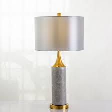 Inspired by classic european table lamps, this table lamp boasts a contemporary twist by adding a white marble base, which goes perfectly with the brass construction. American Light And Luxurious Grey Marble Table Lamp Modern Hotel Villa Bedroom Simple Personality Atmosphere Decoration Bedside Lamp Hs C0012 Modern Lighting Manufacturer