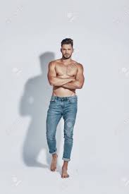 Cool relaxed casual man with crossed arms and titled head looking at camera. Full Length Of Handsome Young Shirtless Man Looking At Camera Stock Photo Picture And Royalty Free Image Image 128618339