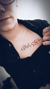 Chest Tattoo With Daughters Initial Date Of Birth And Heart Rate From The First Ultrasound Heart Tattoo Medical Tattoo Heartbeat Tattoo