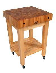 There is a towel rack on the right side of the table. John Boos Gourmet Block Butcher Block Stand Cart