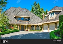 The plan is to change the siding and take down the awnings. Residential House Image Photo Free Trial Bigstock