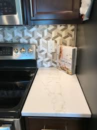 Hanstone quartz bright white kitchen with waterfall edge countertops in tranquility color from cascina collection. Countertops Hanstone Strato Ii Contemporary Kitchen Cedar Rapids By Kitchen Design Gallery Houzz