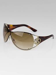 Gucci Gold Tortoise Shell Gg Logo Shield Sunglasses 2802 S Yoogi S Closet Gucci is the name of a luxury italian fashion brand, which was established in 1921 in florence and named after its founder, guccio gucci. usd