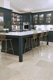 The color of the island gives a beautiful contrast to the white shaker cabinets on the back wall and ties in with the dark wood accents, like the pantry door or wooden backsplash. 20 Dark Kitchen Ideas For Every Kitchen Size