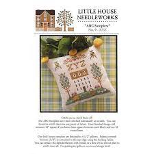 Model stitched over two on 36 ct. Xyz Abc Samplers 9 Cross Stitch Pattern Little House Needleworks Fat Quarter Shop