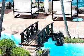 The bridge is now on private property where it was once used as a storage barn before the owner added a road to receive vehicle traffic. Bridge Over Swimming Pool At The Luxury Stock Image Colourbox