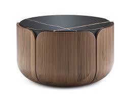 Beautifully shaped and lacquered for extra appearance, this thick coffee table has a unique top and a matching bottom shelf both made of solid wood. Milla Milli Bloom Round Coffee Table In Marble And Solid Wood