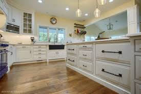 custom glazed kitchen cabinets located