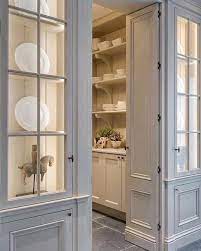 The mirror on the front door features a beveled edge for enhanced style. How To Make Your Kitchen Beautiful With Glass Cabinet Doors Heather Hungeling Design