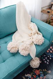 Ikea Hack Make A Cozy Pom Pom Throw Blanket The Diy Mommy In 2021 Diy Throw Blankets Pom Pom Throw Blanket Blanket