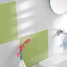 This country inspired bathroom uses a neutral palette of light yellows and browns with contrasting materials like the wood paneling and a metal tub to create depth. Yellow Bathroom Tiles Marazzi