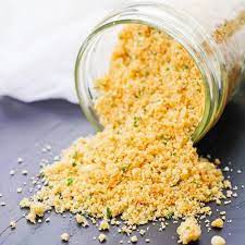 Low Carb Breadcrumbs Spilling On A Grey Background In A Glass Jar Food Substitutions Keto Fast Food Low Carb Easy