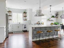 A mint green, wine glass tile backsplash earns a pop of color; White Kitchen Remodel From Dark Cherry To Bright White