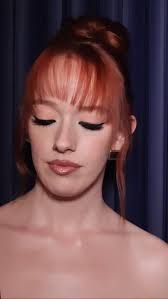 Feline Eyes and glossy sculpted lips