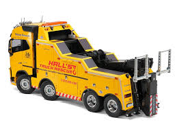 Displayed are different types of drump trucks. Tamiya 56362 1 14 R C Volvo Fh16 Globetrotter 750 8x4 Tow Truck Tamiya Usa