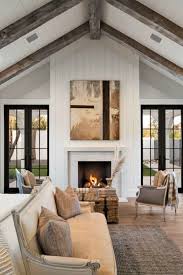 The black modern fireplace in the corner of the living room brings a warm and cozy feel for the room. How To Mix Black White Modern Farmhouse With Classic Tudor Style Hello Lovely Farmhouse Interior Modern Farmhouse Bedroom Farm House Living Room