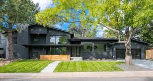 Lush native plants add softness and color to the facade of this contemporary california house. Black House The Beauty Of Black Siding Gambrick