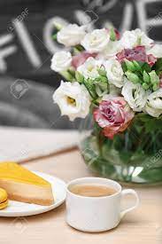 Have a great morning with a cup coffee on morning, as coffee means a lot to us. Cup Of Coffee Tasty Cake And Beautiful Bouquet Of Flowers On Table In Cafe Stock Photo Picture And Royalty Free Image Image 110314167