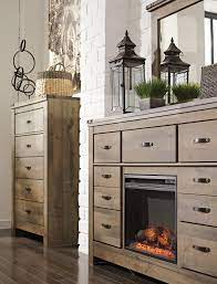 Rolling trundle storage box enables the option of storage or bed. Trinell Dresser With Fireplace By Signature Design By Ashley Nis944237401 Callan Furniture