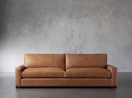 The house is a rustic modern home. Remington Leather Sofa Arhaus