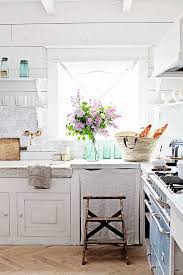 This home feels quiet, timeless yet eclectic and full of personality. French Inspired Kitchen Makeover French Stone Sink Carrara Marble Counters And Subway Tile Lacanche Range Oak Herringbone Floor Dreamy Whites Kitchen Decor Inspiration French Country Kitchens White Kitchen Decor