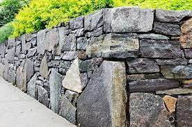 Fieldstone offers a natural material for garden walls. 22 Practical And Pretty Retaining Wall Ideas Trees Com