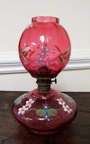 Betty lamps were made of iron or brass, and burned meat fat or fish oil. Rare Small Antique Cranberry Glass Oil Lamp With Enameling Item 1427771