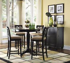 Bar height pub tables are the taller of the two sizes with tables typically measuring between 40 and 48 inches, and chairs measuring between 29 and 32 inches. Dark Wood Round Counter Height Kitchen Table And 4 Chirs Dining Room Traditional Bla Bar Height Dining Table Pub Table And Chairs Dining Table Set Designs