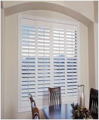 Bahama hurricane shutters hinge at the top and have adjustable arms allowing the shutters to be positioned at various angles. Key West Style