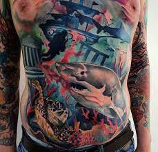 See more ideas about shark tattoos, tattoos, shark. Typical Multicolored Underwater Life With Sharks And Turtle Tattoo On Chest And Belly Tattooimages Biz