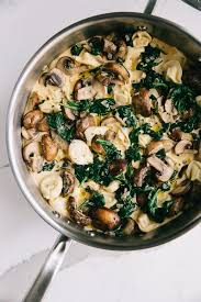 Creamy mushroom spinach pasta with caramelized onions is smothered in parmesan cream sauce. One Pot Creamy Mushroom Tortellini Recipe The Forked Spoon