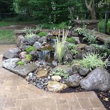 Landscape Garden Design Waterfalls Water Feature Patio Sitting Wall With Pillars Lighting Landscaping Brighton Ny Waterfalls Backyard Backyard Water Feature Water Features In The Garden