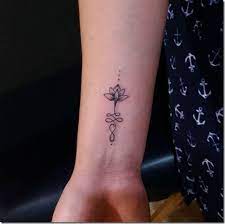 Others tend to combine the lotus flower with another subject with deeper meaning. 50 Wonderful Lotus Flower Tattoo Designs Flower Wrist Tattoos Lotus Flower Tattoo Design Unalome Tattoo