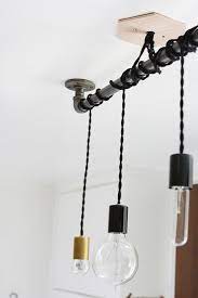 10 Industrial Lighting Ideas You Can Buy Or Diy Hunker Diy Industrial Lighting Industrial Light Fixtures Industrial Lighting