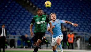 Ciro immobile (lazio) left footed shot from the centre of the box to the bottom right. Lazio Sassuolo 2021 Match Pennant Charitystars