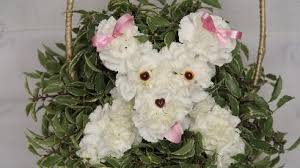 You'll need enough of one color to make the head and body of your pup, but feel free to play around with a variety of textures. How To Make A Puppy Dog In A Basket From Flowers