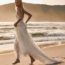 It's beyond dainty and has an incredibly romantic style that is nothing short of breathtaking. 31 Beach Wedding Dresses Perfect For A Seaside Ceremony