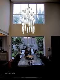 Five 60w candle bulbs (not included) illuminate this pendant and wash your space in a bright glow. Contemporay Dining Chandelier White Candles Chandelier Modern Dining Lights Modern Dining Room Miami By Galilee Lighting Houzz