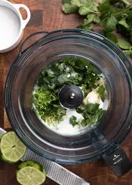 Next add the sour cream, avocado, cilantro, chopped jalapeno and lime juice into a blender or food processor. Erzjzts8nwh3tm