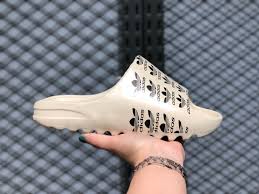 Underfoot, the outsole uses exaggerated flex grooves for enhanced traction. Adidas Yeezy Slide Slippers Bone Bone Black Beach Kenjoo