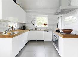 Black And White Kitchen With Wood Countertops White Wood Stainless Steel Modern White Kitchen Design Ideas And Inspiration White Modern Kitchen Minimalist Kitchen Design Kitchen Interior