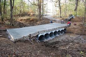 The creek is a dry creek but does channel neighborhood water when it rains. Residential Bridge Construction In Florida Foundation Masters