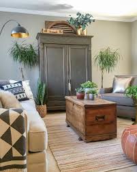 A Black Armoire Is The Focal Point In This Cozy Living Room Kellyelko Com Trunk Or Blanket Ch Cozy Living Rooms Cheap Living Room Furniture Living Room Designs