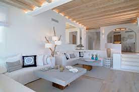 This modern villa is built with the great combination of textures provides by the smoothness of the wood and glass and the roughness of the stone bricks used for the walls and outdoor flooring. Luxury Greek Villas Mykonos Villa For Rent In Mykonos Cyclades Greece Greece House Greek Interior Design Mykonos Villas