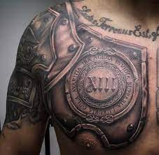 Roman Warrior Armor Tattoo Design On Shoulder And Chest Armor Tattoo Design Ideas Men Masculine Shoulder Armor Tattoo Armour Tattoo Armor Tattoo