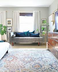 Teal midcentury modern style chairs with a dark wood feature wall. 21 Beautiful Colors That Always Pair Well With Teal