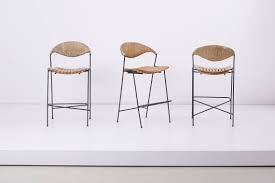 We offer a wide range of bar stools. Set Of Three Wrought Iron Bar Stools By Arthur Umanoff