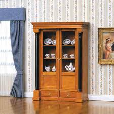 Cabinet definition, a piece of furniture with shelves, drawers, etc., for holding or displaying items: Biedermeier Display Cabinet 40096