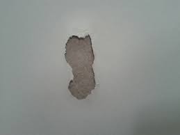 Woman removing old wallpaper from the wall, home renovation concept. Paint Got Ripped Off When Trying To Remove Double Sided Foam Tape Home Improvement Stack Exchange