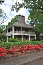 The new porch extends the length of the front of the house, makes a neat mitered corner, and then runs along the side of the house, where a rickety side porch once stood. Louisiana Style Wrap Around Porch Yeary Lindsey Architects